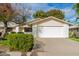 Single story home with attached garage, landscaping, and large driveway at 12510 W Brandywine Dr, Sun City West, AZ 85375