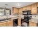 Bright kitchen features ample cabinetry, modern appliances, and a double sink at 12510 W Brandywine Dr, Sun City West, AZ 85375