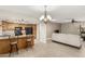 Open kitchen with oak cabinets, black appliances, and a breakfast bar at 12510 W Brandywine Dr, Sun City West, AZ 85375