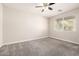 Cozy bedroom with carpeted floor and ceiling fan at 1270 E Marcella Ln, Gilbert, AZ 85295