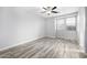 Spacious bedroom with ceiling fan and wood-look tile floors at 1270 E Marcella Ln, Gilbert, AZ 85295