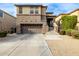 Two-story house with attached garage and landscaping at 1270 E Marcella Ln, Gilbert, AZ 85295