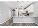 Modern kitchen with granite island and white cabinets at 1270 E Marcella Ln, Gilbert, AZ 85295