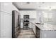 Modern kitchen with stainless steel appliances and white cabinets at 1270 E Marcella Ln, Gilbert, AZ 85295