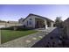 Artificial turf backyard with gravel and patio at 1374 E Kingman Pl, Casa Grande, AZ 85122