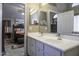 Bathroom boasts double sinks and a view into bedroom at 1374 E Kingman Pl, Casa Grande, AZ 85122