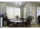 Cozy breakfast nook with table and chairs near sliding door at 1374 E Kingman Pl, Casa Grande, AZ 85122