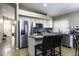 Kitchen with island, stainless steel appliances, and white cabinets at 1374 E Kingman Pl, Casa Grande, AZ 85122