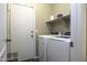 Laundry room with washer, dryer, and overhead shelving at 1374 E Kingman Pl, Casa Grande, AZ 85122