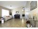 Living room with tiled floors, piano and comfortable seating at 1374 E Kingman Pl, Casa Grande, AZ 85122