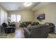 Living room with ample seating and a large TV at 1374 E Kingman Pl, Casa Grande, AZ 85122