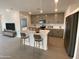 Modern kitchen with gray cabinets and an island at 1393 W Inca Dr, Coolidge, AZ 85128