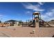 Community playground with play structure, swings, and shaded seating area at 1393 W Inca Dr, Coolidge, AZ 85128