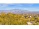 Stunning aerial view showcasing expansive mountain ranges and city landscape at 15418 N Castillo Dr, Fountain Hills, AZ 85268