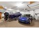 Garage with Tesla and boat storage at 15418 N Castillo Dr, Fountain Hills, AZ 85268