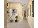 Long hallway with tiled floor and artwork at 15418 N Castillo Dr, Fountain Hills, AZ 85268