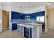 Modern kitchen with blue cabinets, large island, and stainless steel appliances at 15418 N Castillo Dr, Fountain Hills, AZ 85268