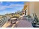 Stone patio with seating area and beautiful desert landscaping at 15418 N Castillo Dr, Fountain Hills, AZ 85268