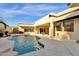 Inviting pool with a waterfall feature and spacious patio at 15418 N Castillo Dr, Fountain Hills, AZ 85268