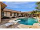 Spacious backyard with a refreshing pool and a diving board at 160 W La Vieve Ln, Tempe, AZ 85284