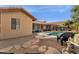 Landscaped backyard featuring a pool, patio, and stone pathway at 160 W La Vieve Ln, Tempe, AZ 85284