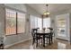 Bright dining area with table and chairs, and access to the backyard at 160 W La Vieve Ln, Tempe, AZ 85284