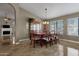 Spacious dining area with a large table, wooden hutch and tiled floor at 160 W La Vieve Ln, Tempe, AZ 85284