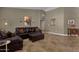 Living room with brown leather furniture and tiled floors at 160 W La Vieve Ln, Tempe, AZ 85284