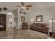 Bright living room with tiled floors, comfy seating, and ceiling fan at 160 W La Vieve Ln, Tempe, AZ 85284