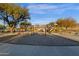 Play area with swings and play structures at 160 W La Vieve Ln, Tempe, AZ 85284