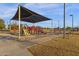 Play area with shade structure and play equipment at 160 W La Vieve Ln, Tempe, AZ 85284