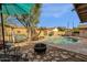 Inviting backyard with pool, fire pit, and seating at 160 W La Vieve Ln, Tempe, AZ 85284