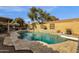 Relaxing kidney-shaped pool with diving board and patio seating at 160 W La Vieve Ln, Tempe, AZ 85284