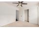 Bright bedroom featuring ceiling fan and built-in closet at 16019 S 40Th Way, Phoenix, AZ 85048