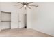 Well-lit bedroom with ceiling fan and sliding door closet at 16019 S 40Th Way, Phoenix, AZ 85048