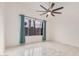 Spacious bedroom with ceiling fan and large window at 16019 S 40Th Way, Phoenix, AZ 85048