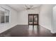 Dining room with dark hardwood floors and French doors at 16019 S 40Th Way, Phoenix, AZ 85048