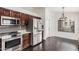 Updated kitchen featuring stainless steel appliances and dark wood cabinets at 16019 S 40Th Way, Phoenix, AZ 85048