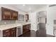 Spacious kitchen with dark wood cabinetry and granite countertops at 16019 S 40Th Way, Phoenix, AZ 85048