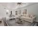 Virtually staged living area featuring hardwood floors, a dining area, and ample natural light at 16019 S 40Th Way, Phoenix, AZ 85048