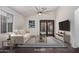 Virtually staged living room with comfy seating, large windows, and a modern coffee table at 16019 S 40Th Way, Phoenix, AZ 85048