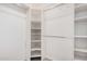 Spacious walk-in closet with ample shelving and hanging rods at 16019 S 40Th Way, Phoenix, AZ 85048