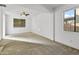 Well-lit bedroom with neutral carpet and a window at 16508 N 71St Ave, Peoria, AZ 85382