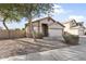 Charming one-story home with front yard landscaping and trees at 16508 N 71St Ave, Peoria, AZ 85382