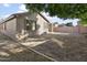 Back exterior of house with small yard and trees at 16508 N 71St Ave, Peoria, AZ 85382