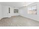 Spacious living room with wood-look tile floor and neutral walls at 16508 N 71St Ave, Peoria, AZ 85382