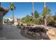 Landscaped backyard oasis with a waterfall feature at 19941 N Summer Dream Dr, Surprise, AZ 85374