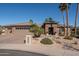 Single-story home with stone accents and a three-car garage at 19941 N Summer Dream Dr, Surprise, AZ 85374