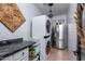 Modern laundry room with stainless steel appliances and dark countertop at 19941 N Summer Dream Dr, Surprise, AZ 85374