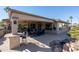 Spacious covered patio with seating area and outdoor lighting at 19941 N Summer Dream Dr, Surprise, AZ 85374